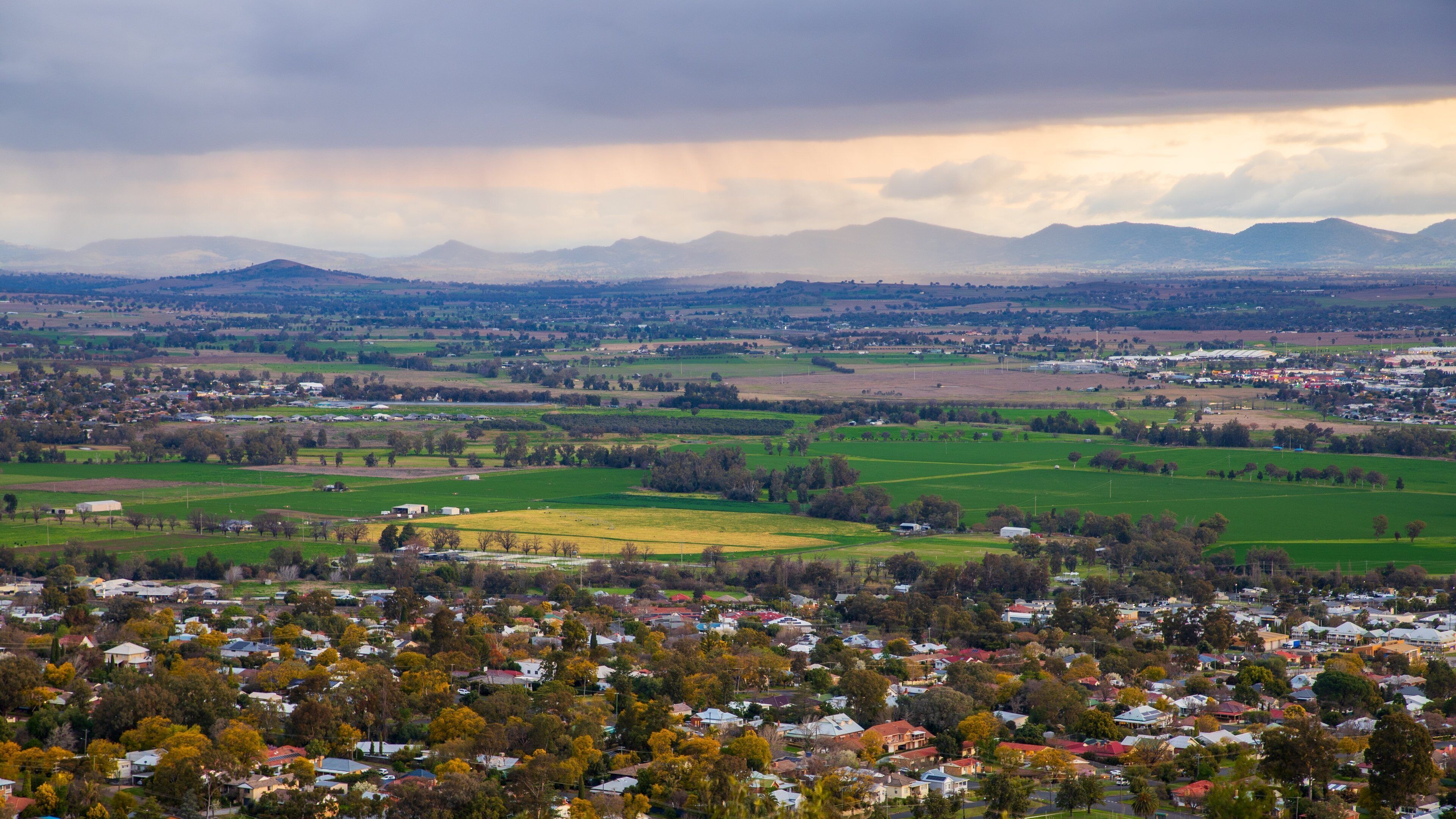 Oxley Scenic Lookout which includes landscape views, a small town or village and a sunset