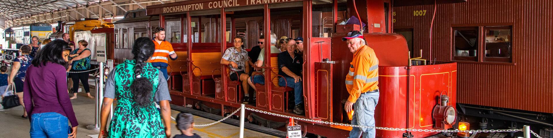 Archer Park Station & Steam Train Museum featuring heritage elements and railway items as well as a small group of people