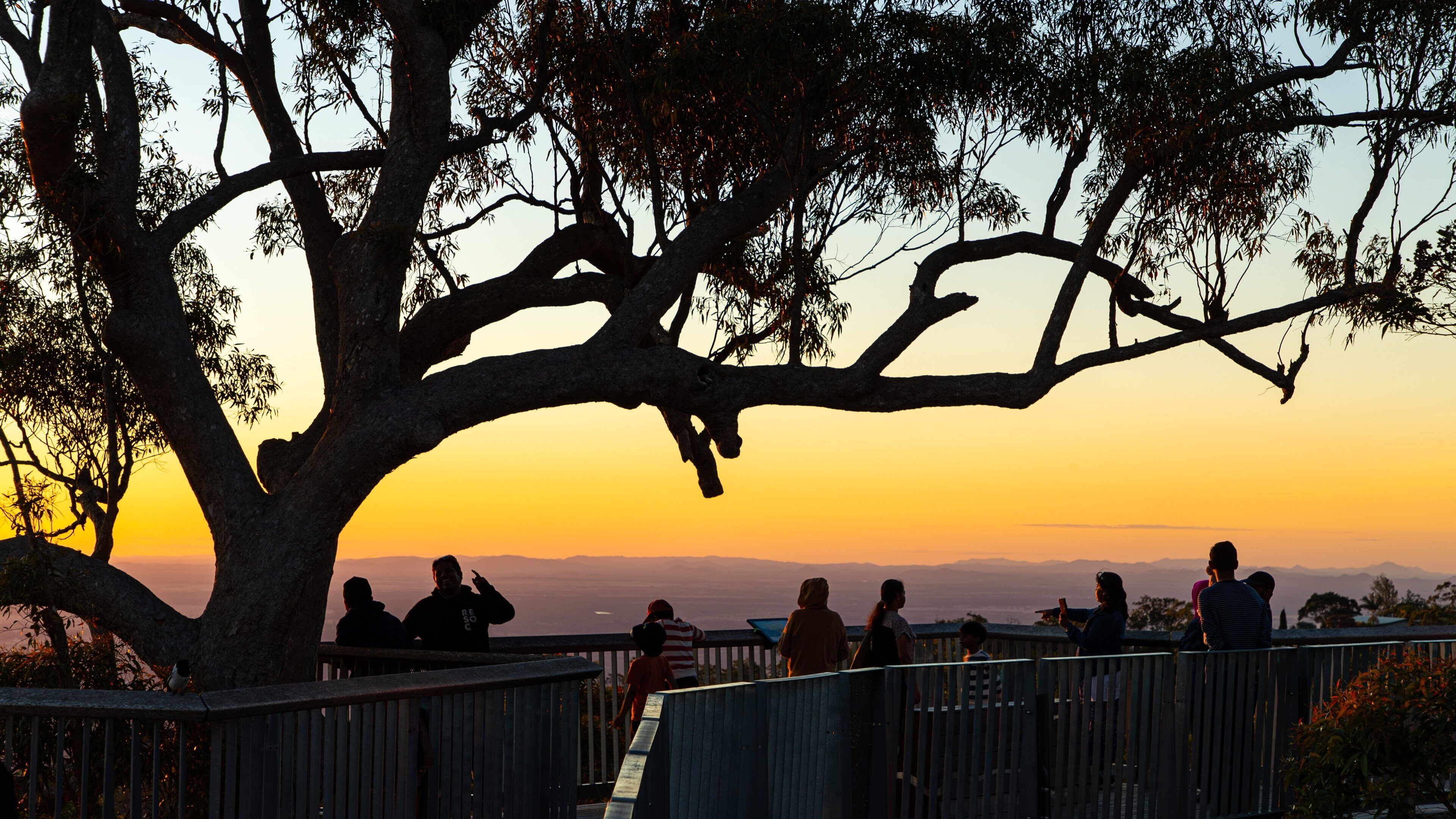 Berserker showing views and a sunset as well as a small group of people