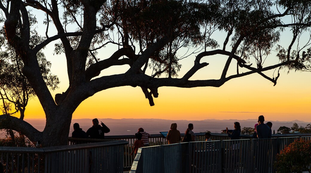 Berserker showing views and a sunset as well as a small group of people