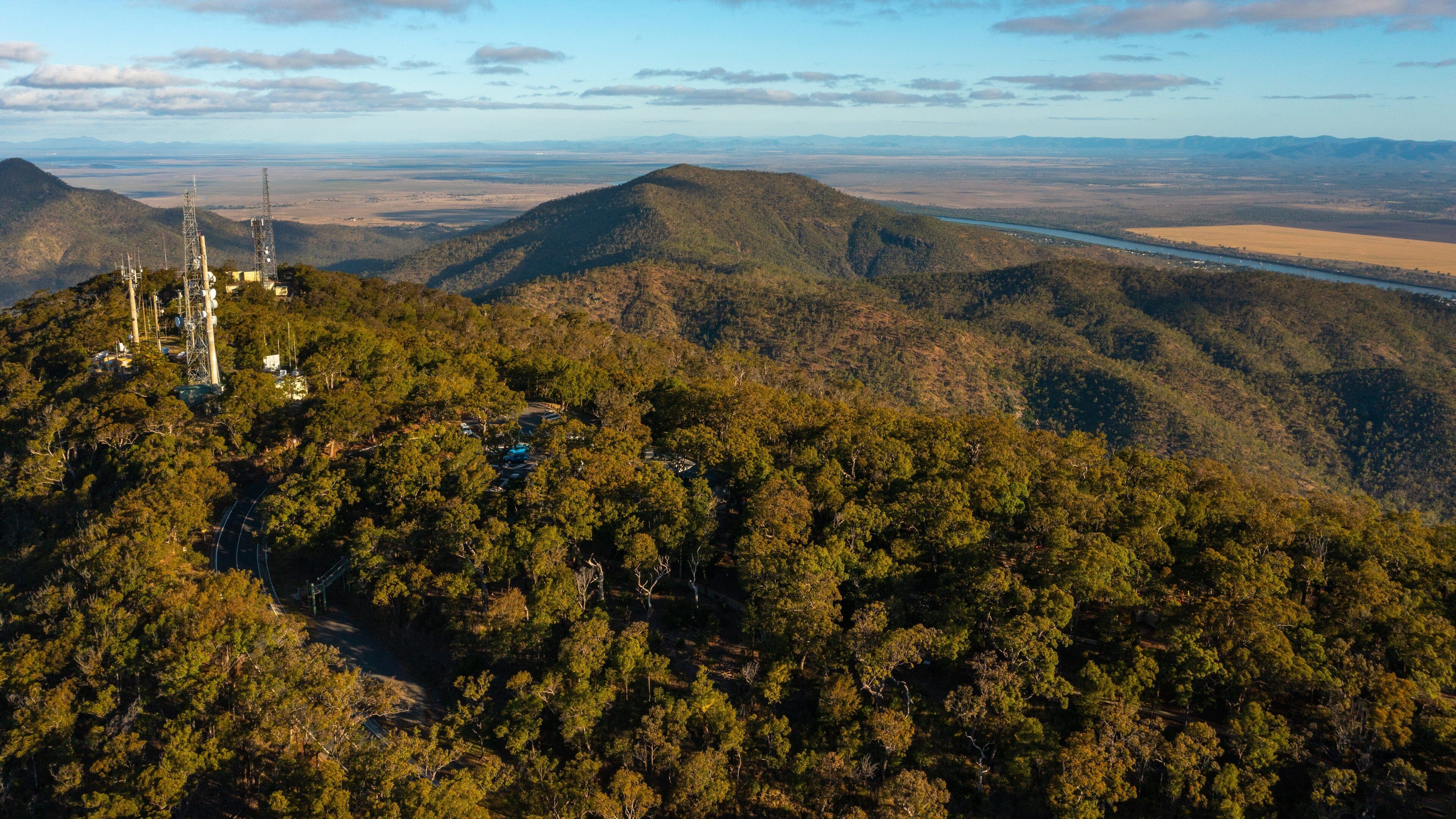 Mt Archer showing landscape views, mountains and a sunset