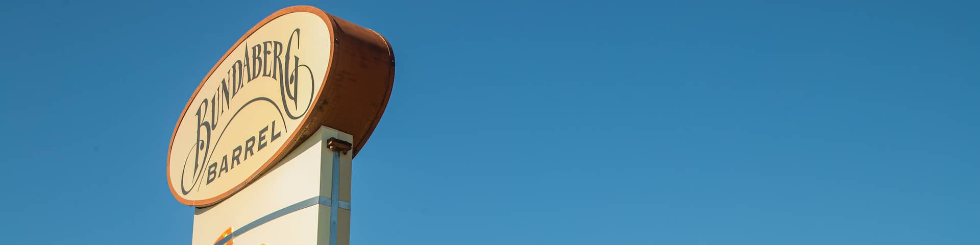 A sign for Bundaberg Barrel with a ginger beer advertisement.