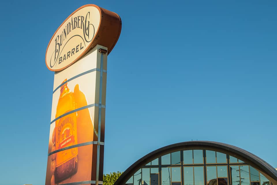 A sign for Bundaberg Barrel with a ginger beer advertisement.