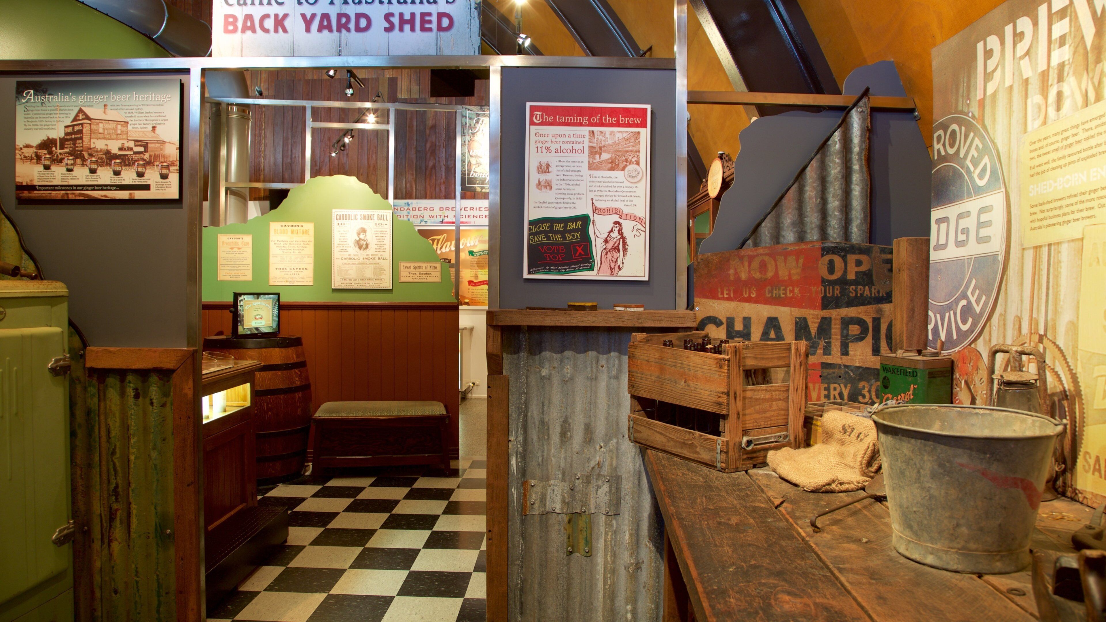 A rustic bar with vintage decor, including a checkered floor, wooden barrels, and historical posters.
