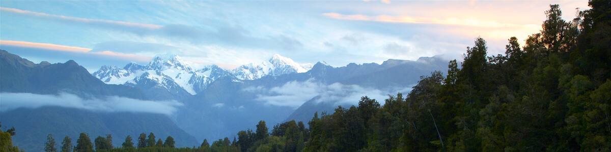 Fox Glacier which includes a lake or waterhole, a sunset and mountains