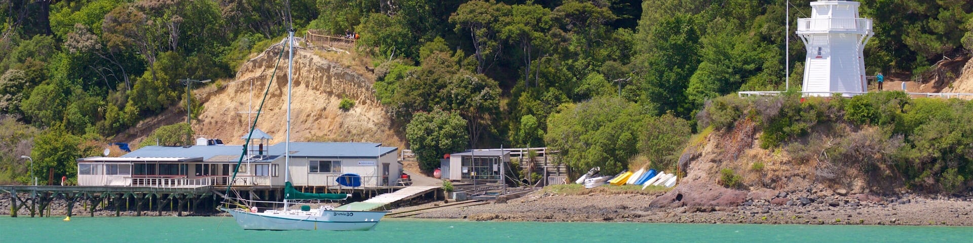 Akaroa Lighthouse featuring a lighthouse and a bay or harbor