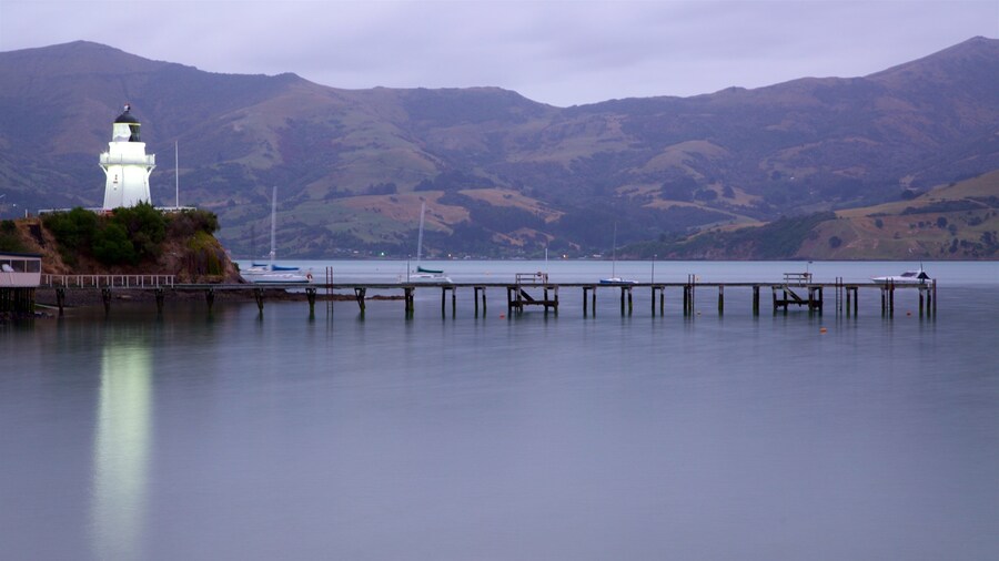 Akaroa Lighthouse which includes a lighthouse, tranquil scenes and a sunset