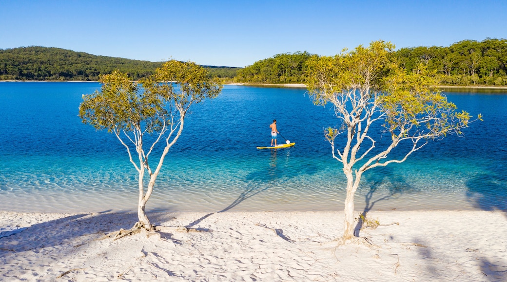 Stand up paddle boarding on Lake Mckenzie, Fraser Island