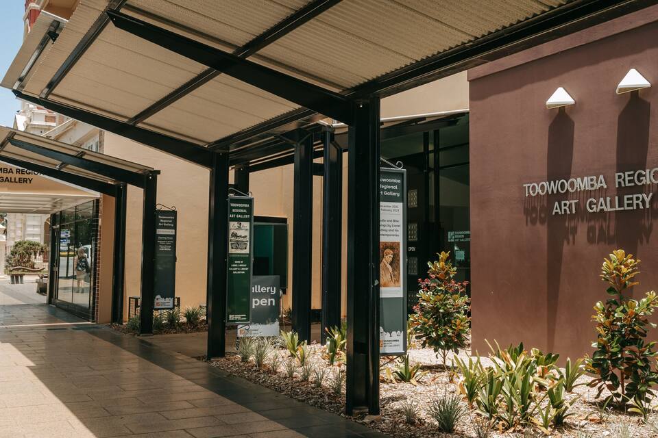 The exterior of the Toowoomba Regional Art Gallery with signage and architectural details.