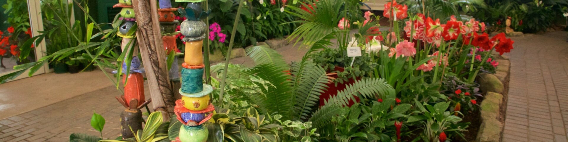 Botanica & Cafler Park featuring a garden, flowers and interior views