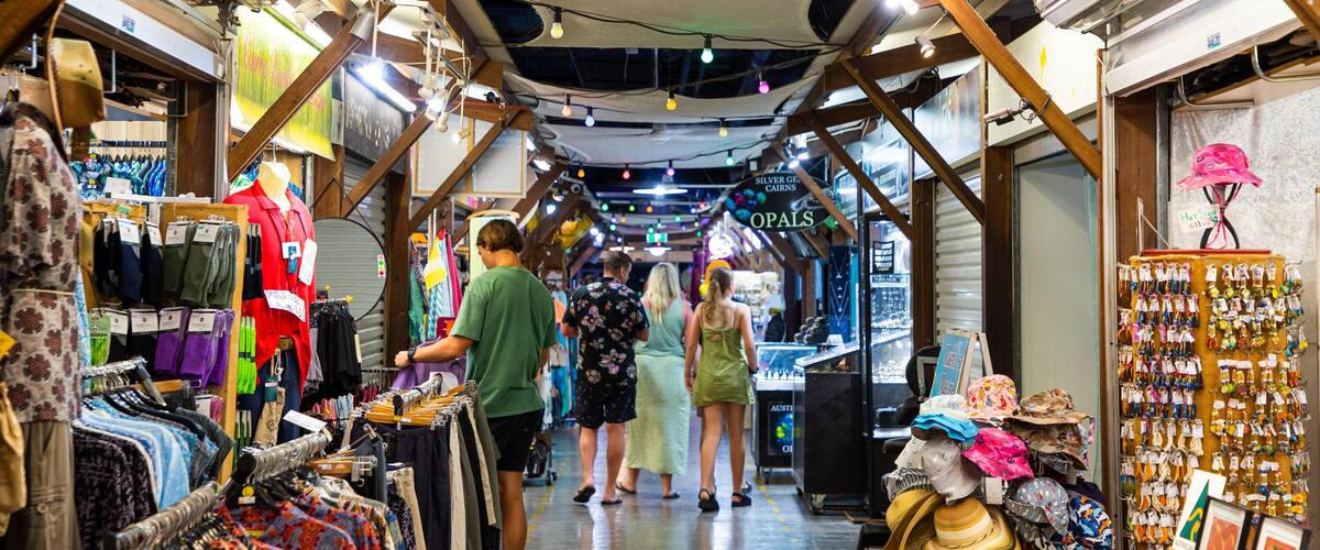 Cairns Night Markets showing markets as well as a small group of people