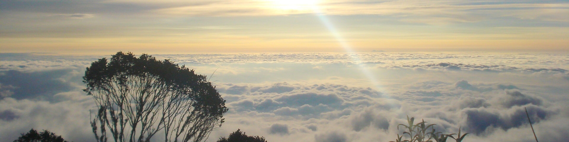 Farallones de Cali National Park which includes landscape views and a sunset