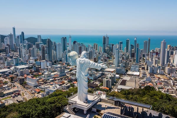 Panoramic aerial view of the Cristo Luz statue and buildings in the city of Balneário Camboriú – Santa Catarina - Brazil
