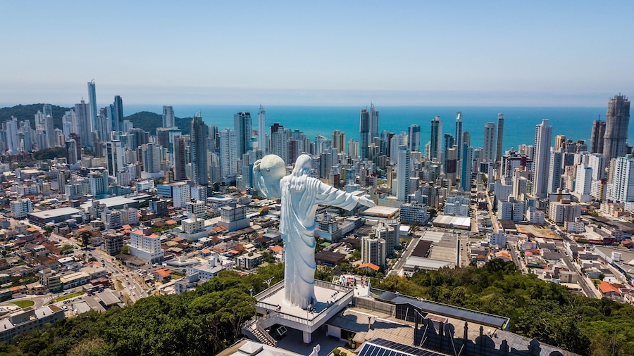 Panoramic aerial view of the Cristo Luz statue and buildings in the city of Balneário Camboriú – Santa Catarina - Brazil