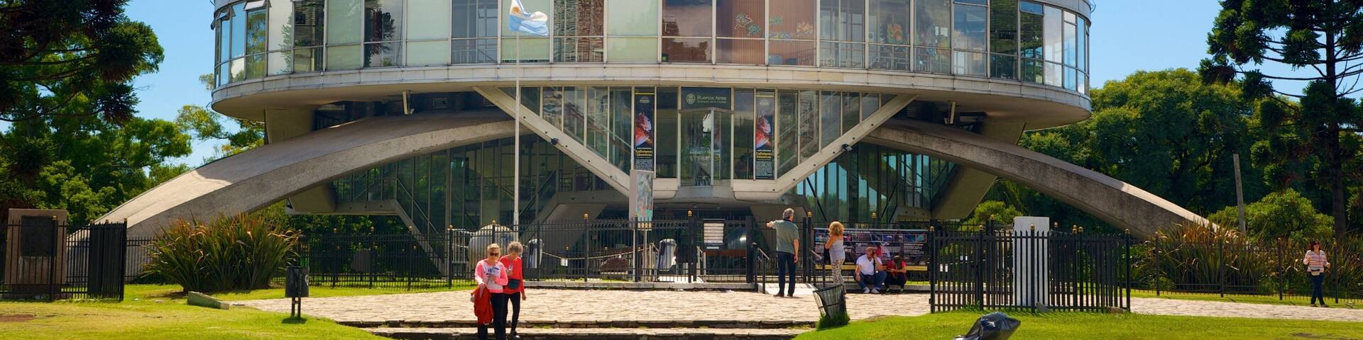 A modern spherical building with a glass facade and a unique architectural design.