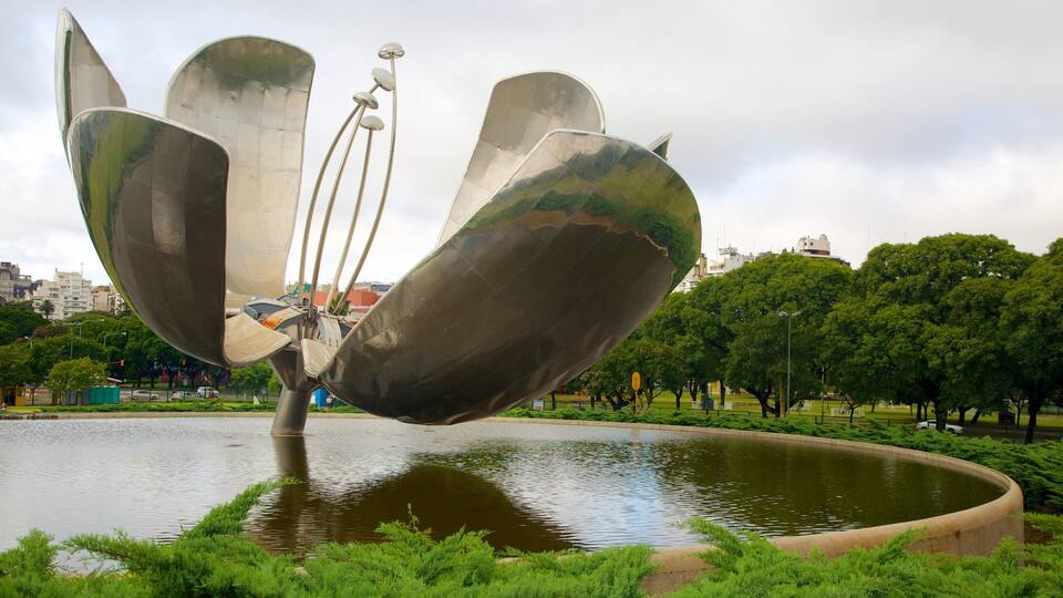 Buenos Aires showing outdoor art, a garden and a pond