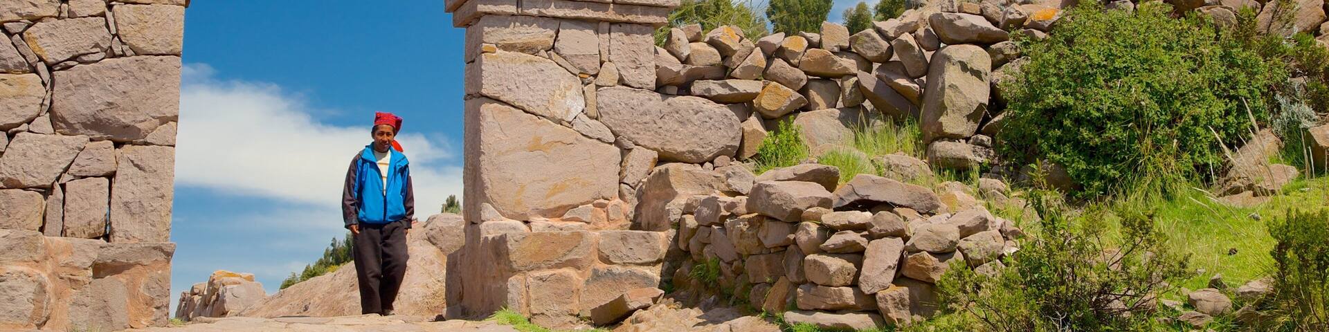 Lake Titicaca showing heritage elements as well as an individual male