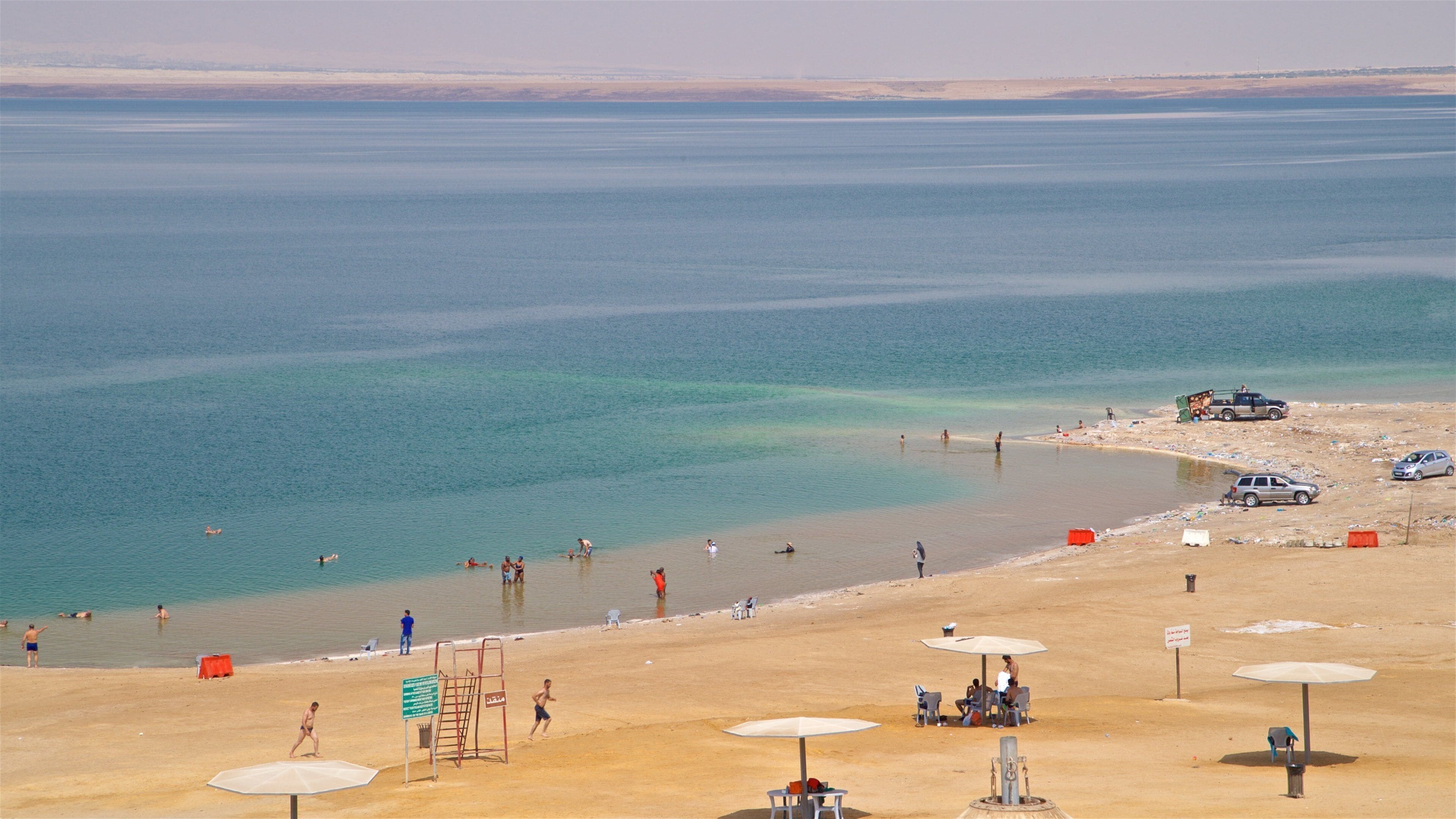 Amman Beach which includes a beach, swimming and general coastal views