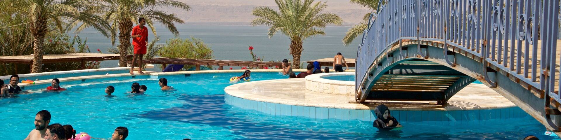 Sweimeh which includes general coastal views, a pool and swimming