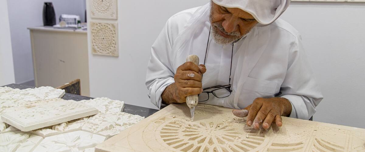 Al Jasra Handicraft Centre showing interior views as well as an individual male