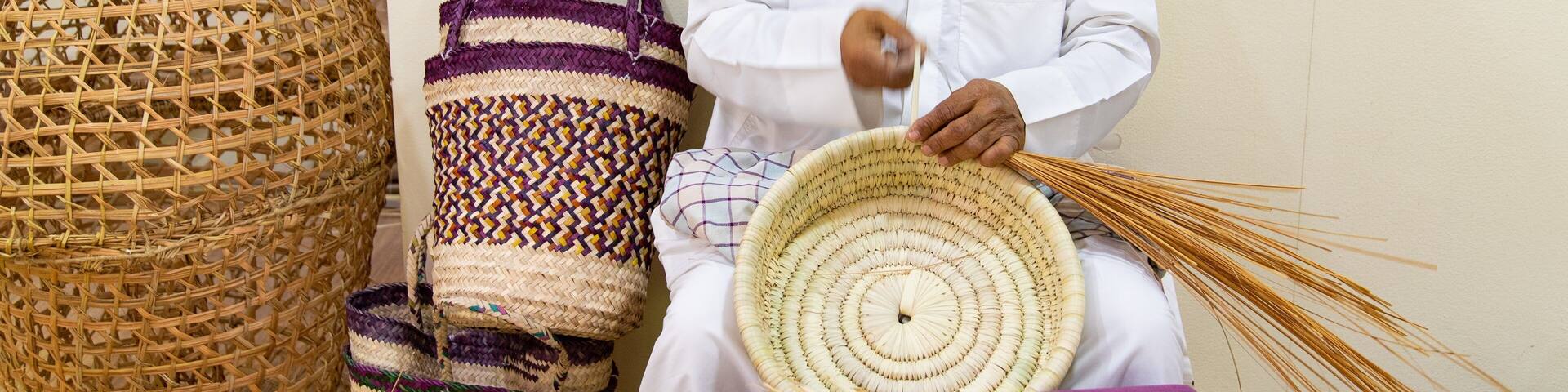 Al Jasra Handicraft Centre which includes markets as well as an individual male