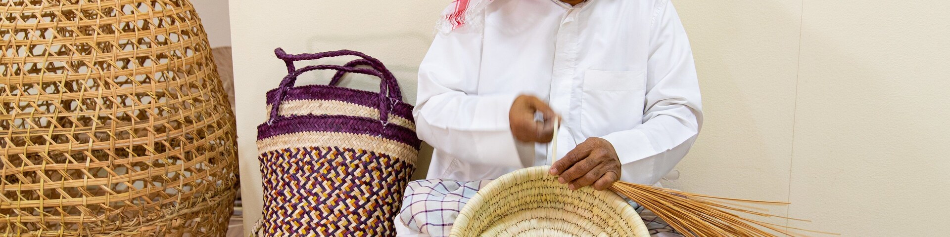 Al Jasra Handicraft Centre which includes markets as well as an individual male