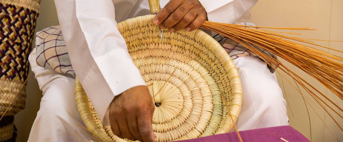 Al Jasra Handicraft Centre featuring markets as well as an individual male