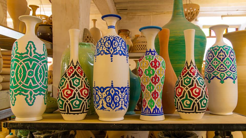 A collection of intricately patterned vases on display.