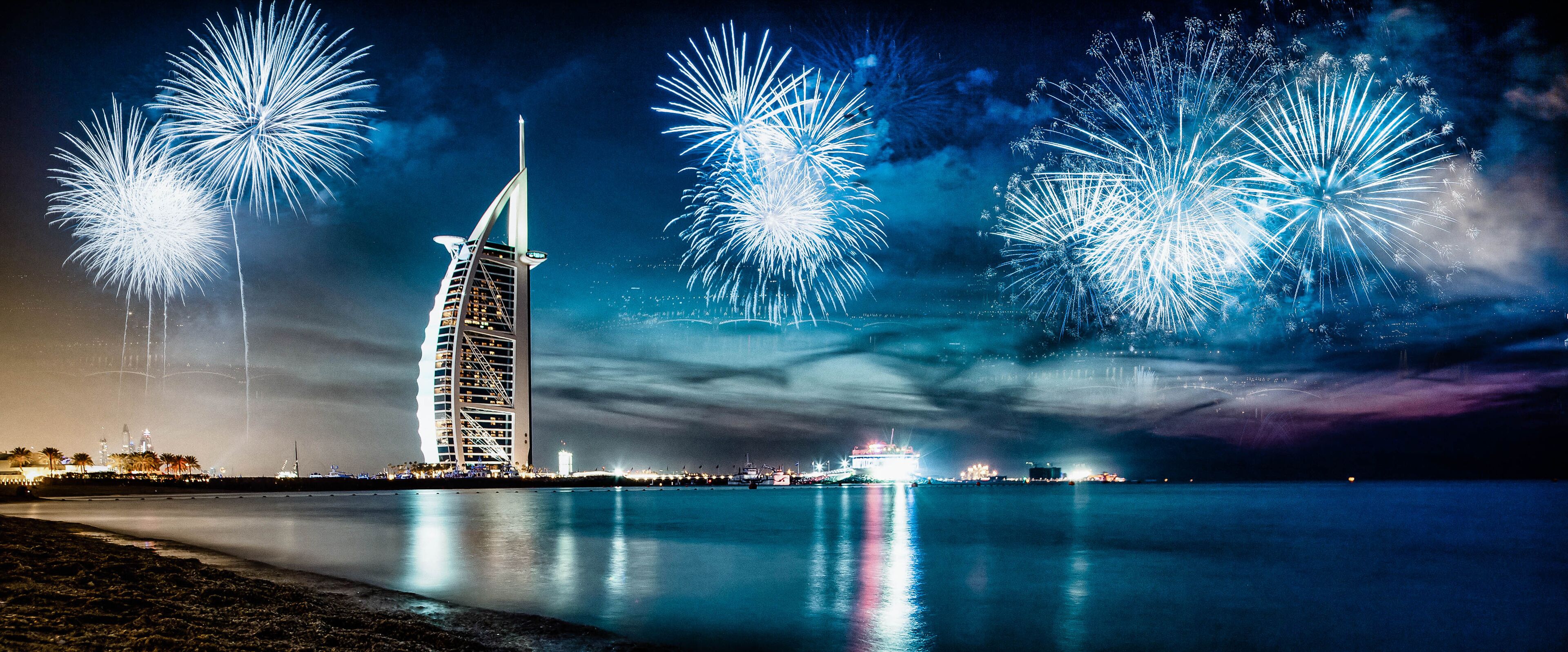 fireworks around Burj Al Arab - exotic New Year destination, Dubai, UAE