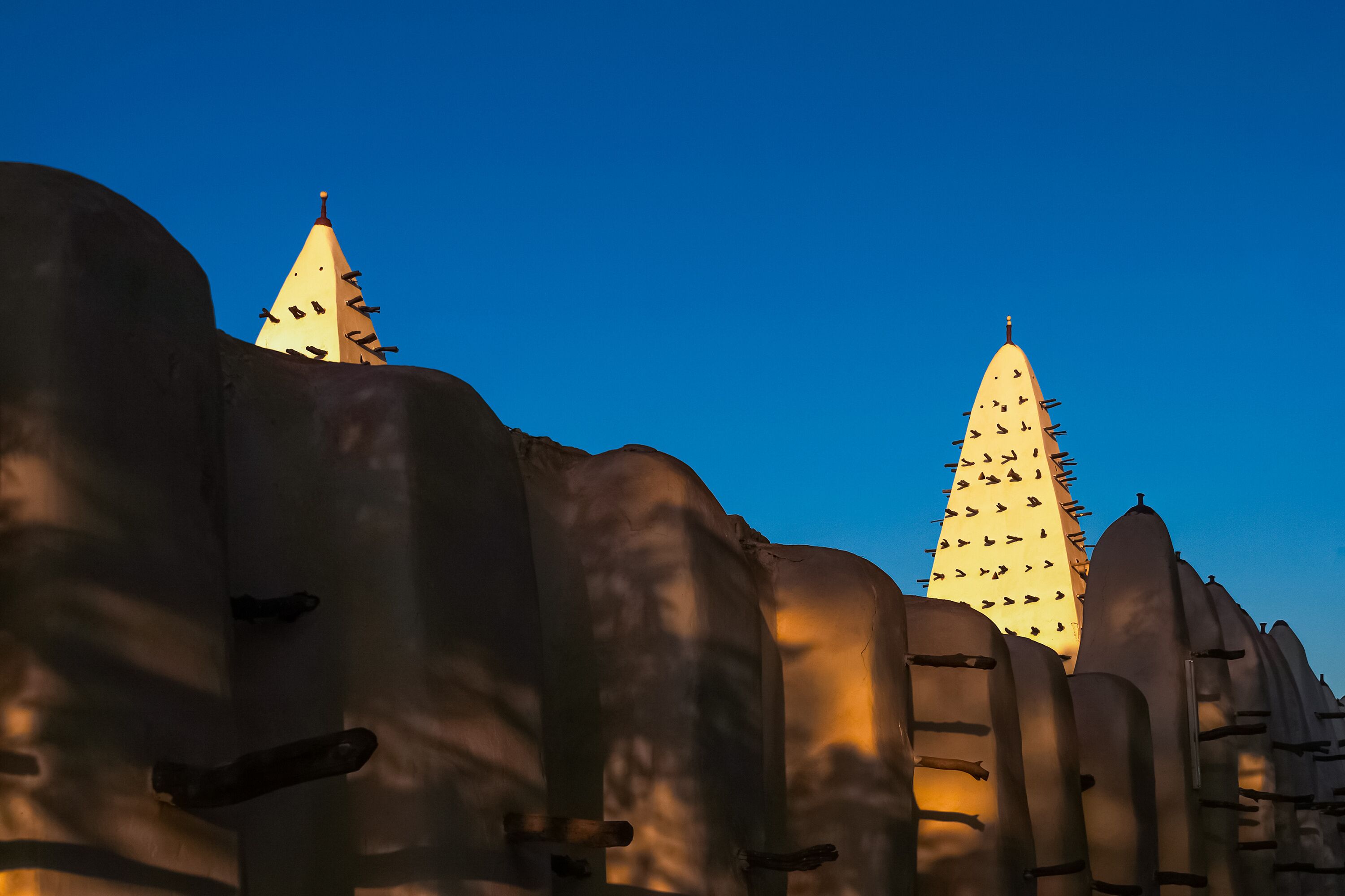 Walls and towers of the Mosque of Bobo-Dioulasso building exterior at sunset, landmark of Burkina Faso, West Africa.