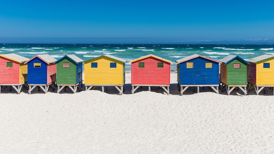 Colored Beach Houses in Muizenberg under blue sky, Cape Town, South Africa, beach huts