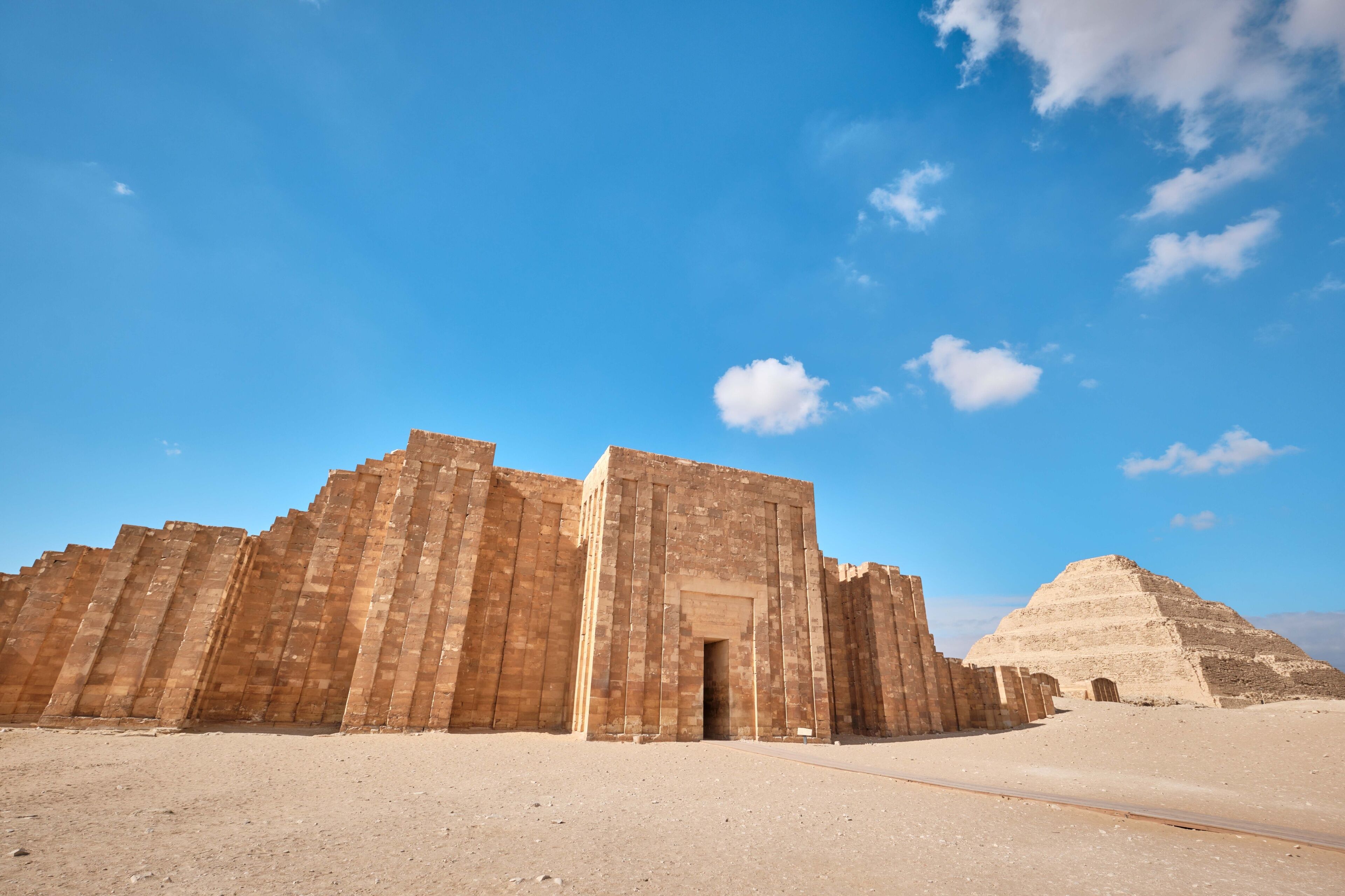 Saqqara, Egypt - January 2, 2024: Entrance to the mortuary temple near the pyramid of Djoser in Saqqara. Roofed colonnade entrance of Step Pyramid