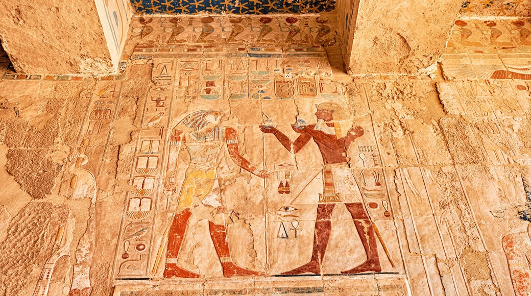 Egyptian wall murals and frescoes and paintings in Hatshepsut temple in Luxor. Religious mysteries and rituals in Egypt mythology and religion