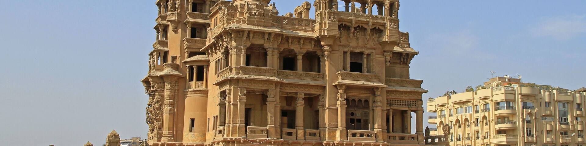 A large, ornate temple with multiple domes and intricate carvings.