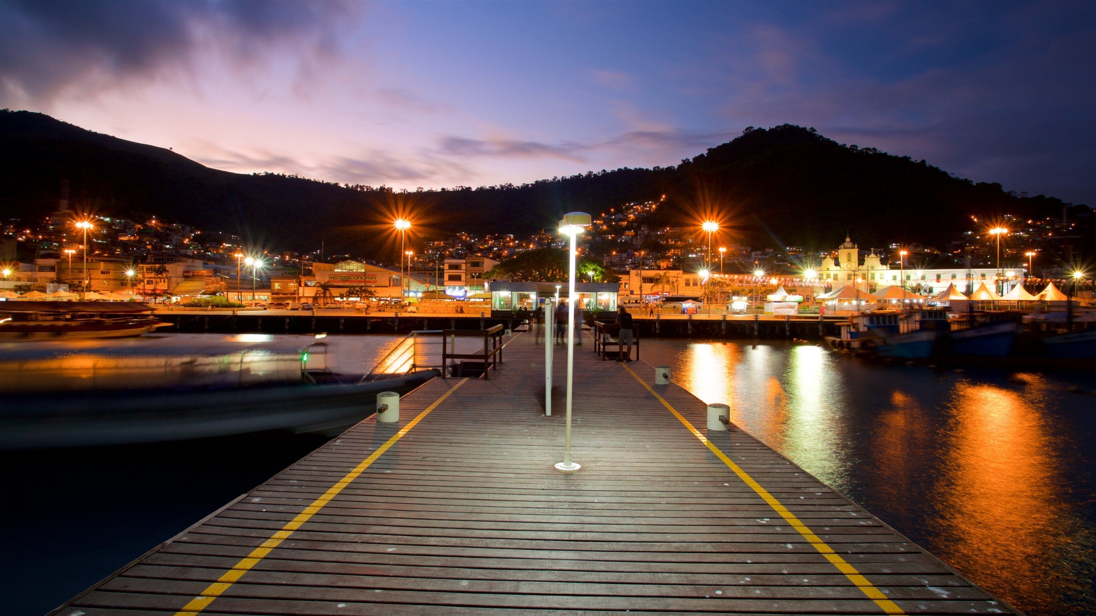 Cais Turistico de Santa Luzia which includes a bay or harbor and night scenes