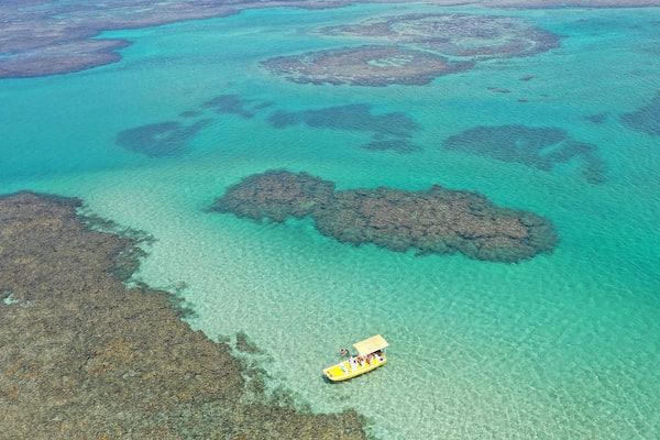 Panoramic view of turquoise waters of Sao Miguel dos Milagres in Alagoas State, Brazil