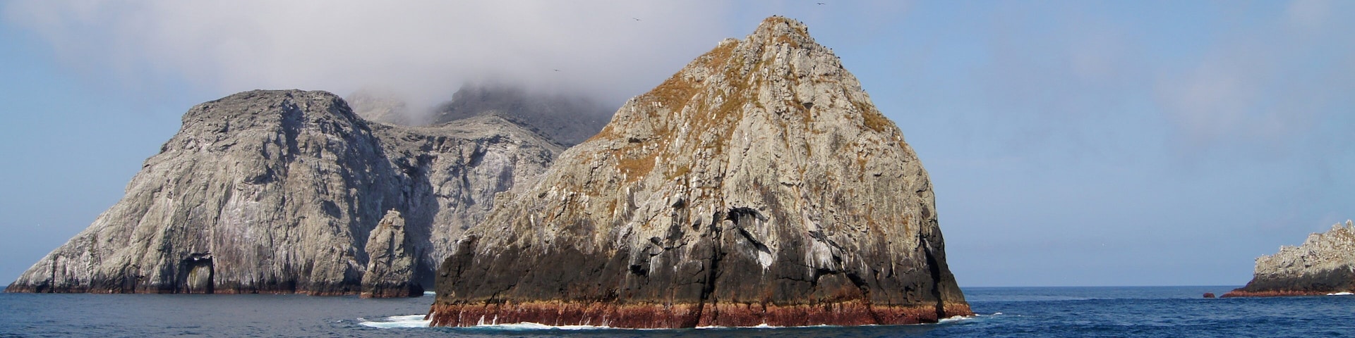 Malpelo Fauna and Flora Sanctuary showing rugged coastline, general coastal views and island views