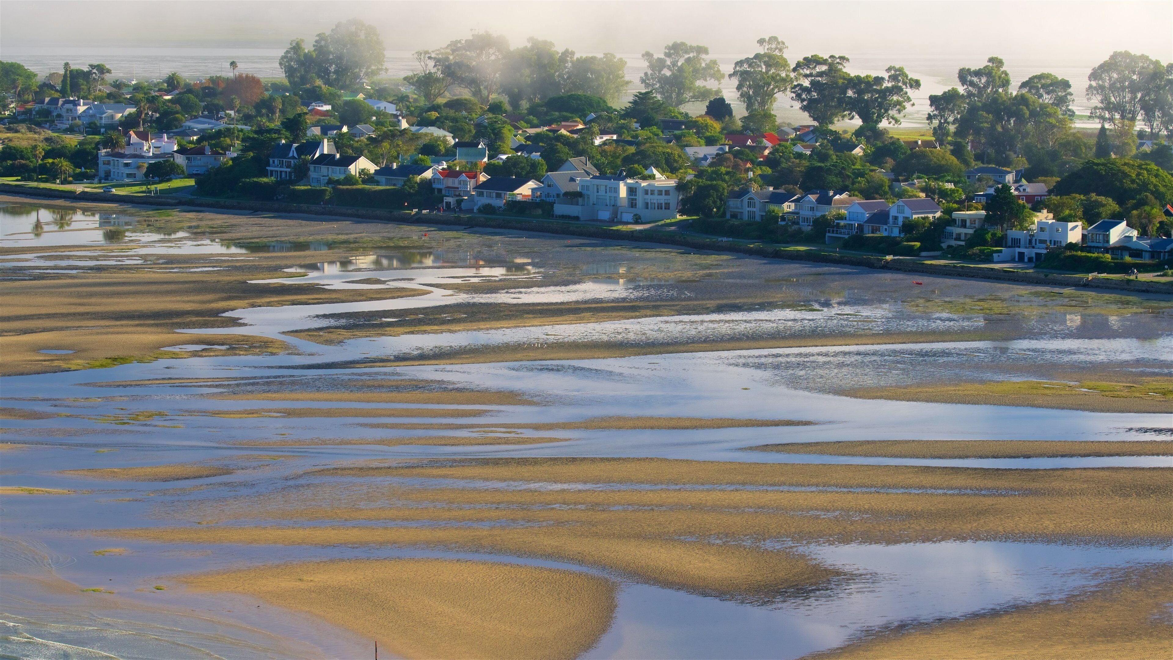 Knysna which includes a sunset, a sandy beach and general coastal views