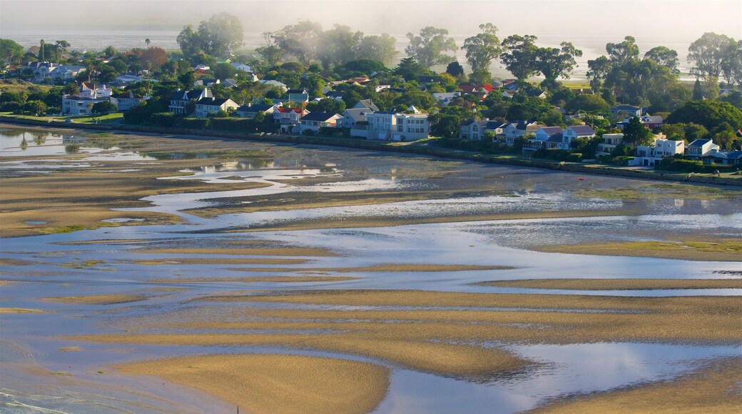 Knysna which includes a sunset, a sandy beach and general coastal views