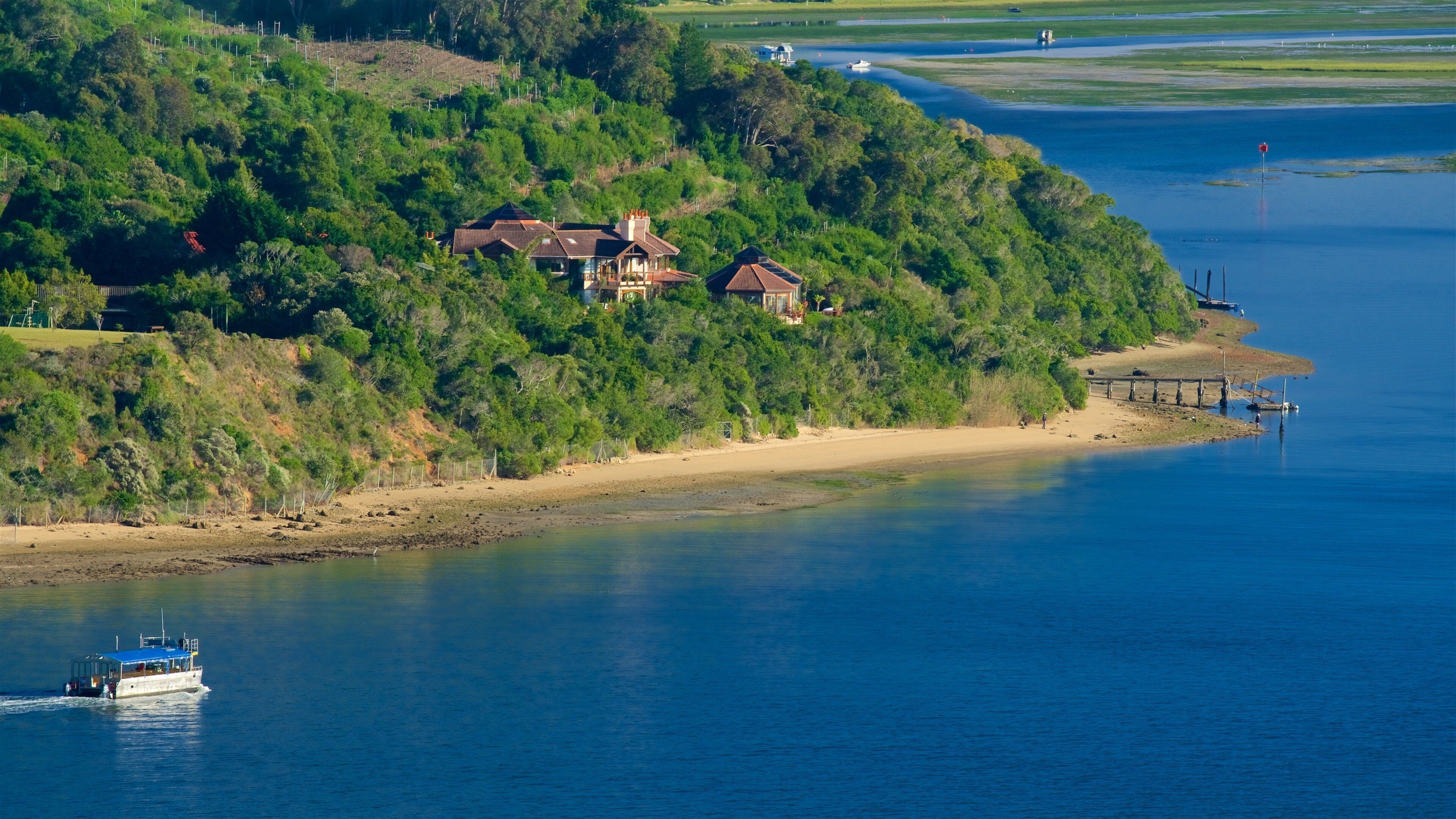 Knysna Lagoon featuring general coastal views, boating and a beach