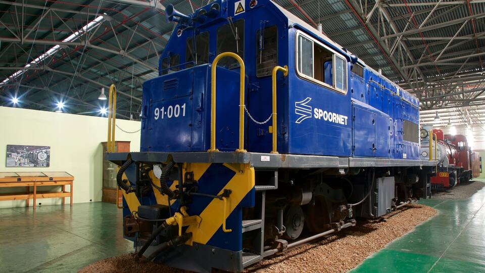 A blue and yellow train engine with the number 91-001 and the name SPOORNET.