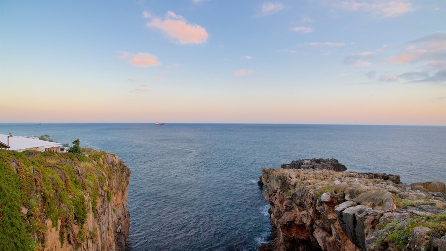 Boca do Inferno featuring general coastal views, rugged coastline and a sunset