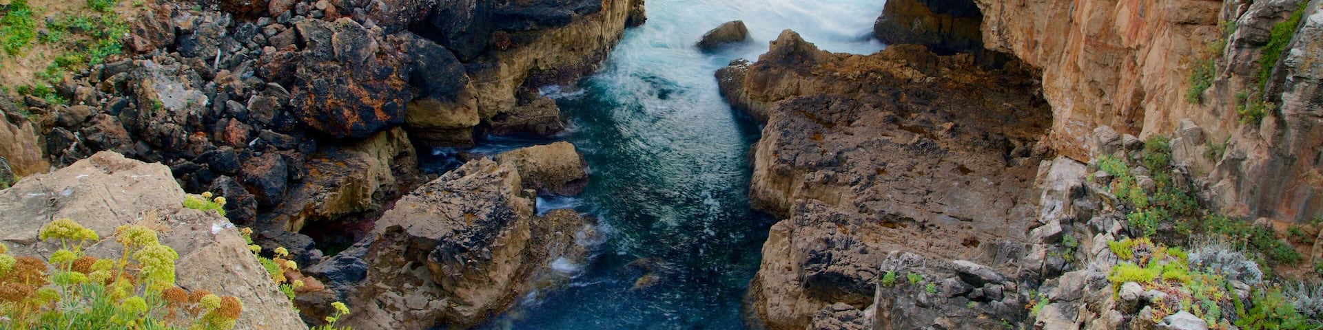 Boca do Inferno which includes rugged coastline and general coastal views