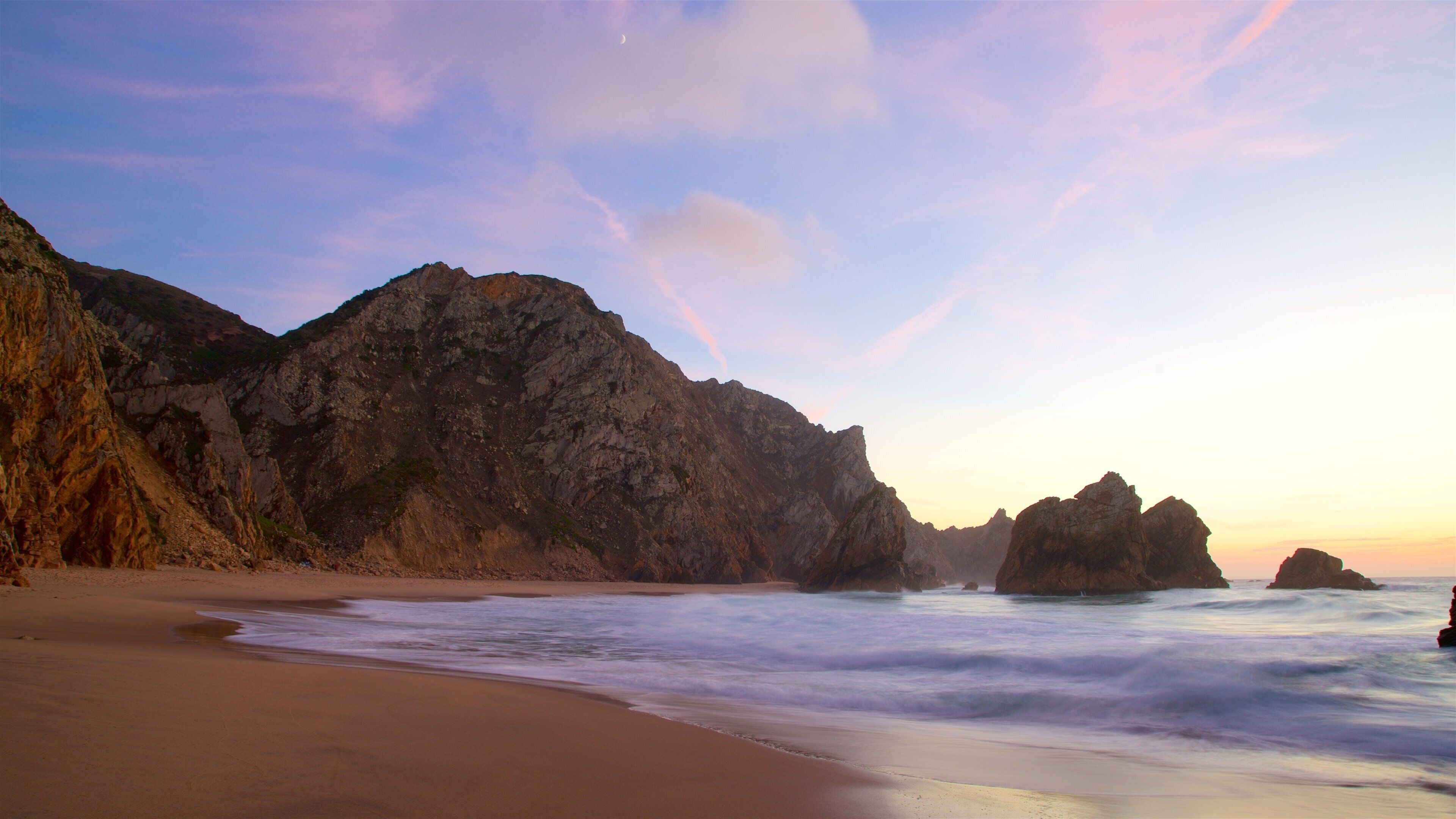 Ursa Beach featuring rugged coastline, general coastal views and a sunset