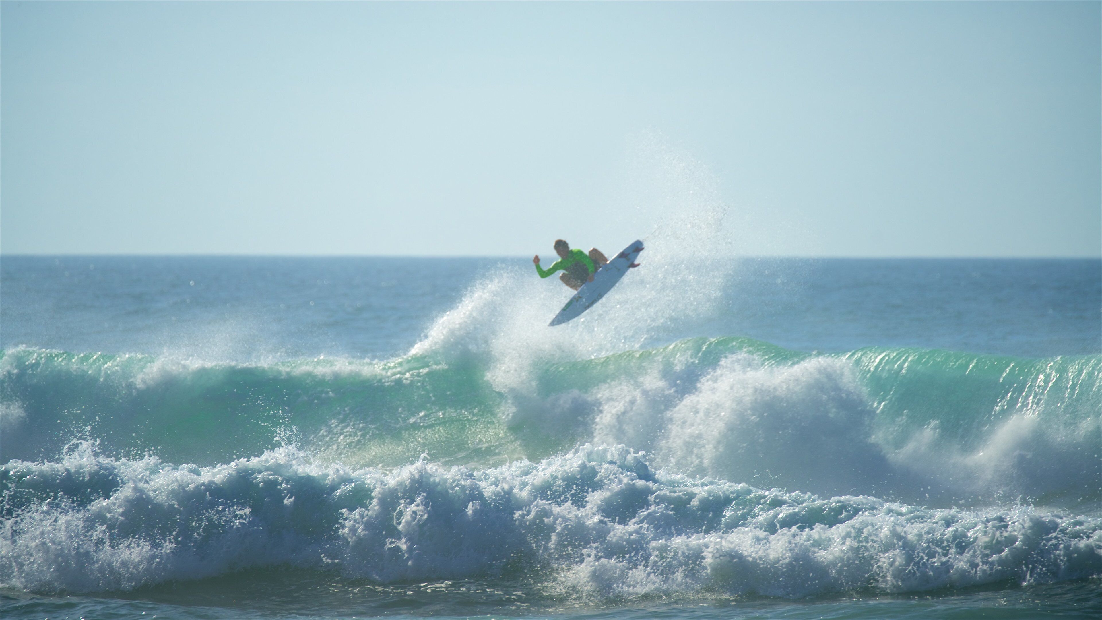 Adraga Beach showing waves, general coastal views and surfing