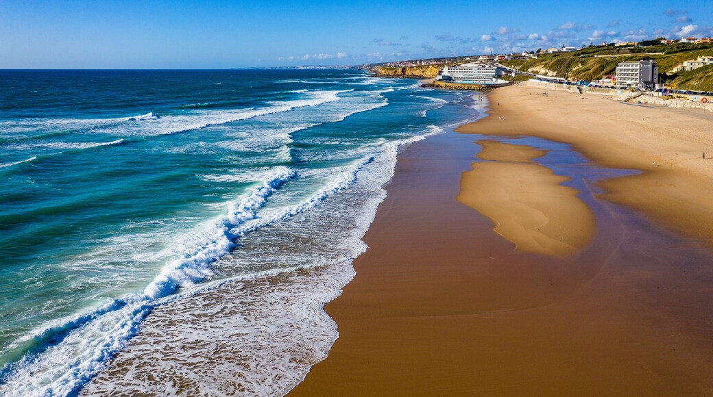 Praia Grande, Portugal. Beautiful sunset in the portuguese beach Praia Grande, in Portugal. Beach of Praia Grande. View of Atlantic beach and big waves. Colares, Sintra, Portugal.