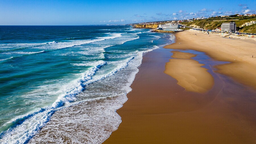 Praia Grande, Portugal. Beautiful sunset in the portuguese beach Praia Grande, in Portugal. Beach of Praia Grande. View of Atlantic beach and big waves. Colares, Sintra, Portugal.