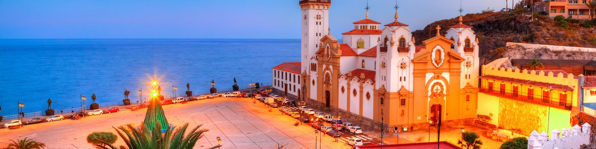 Panoramic view of Santa Cruz catholic church illuminated in evening, in Christmas holiday, Tenerife, Spain