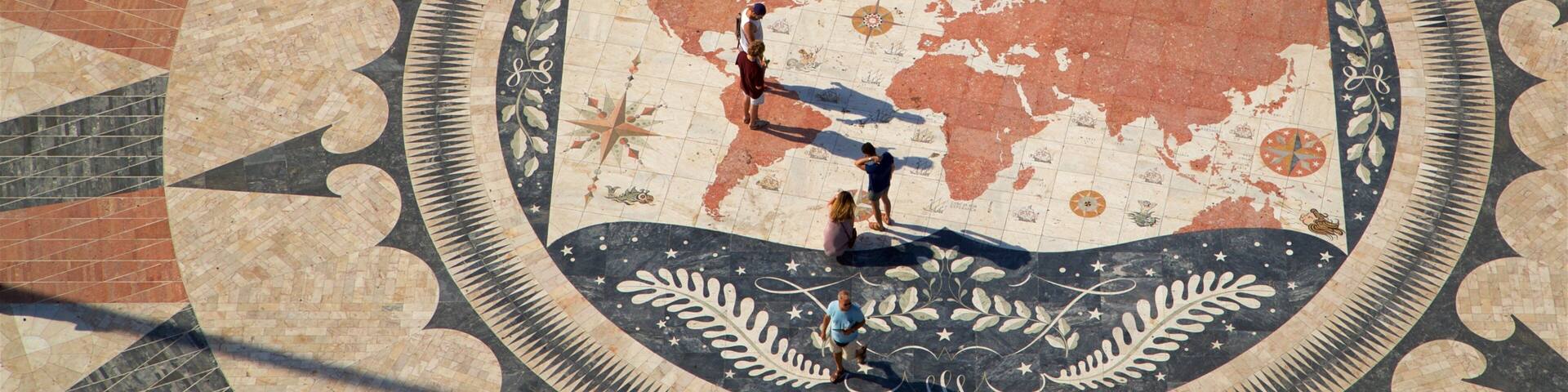 Padrão dos Descobrimentos which includes a square or plaza as well as a small group of people