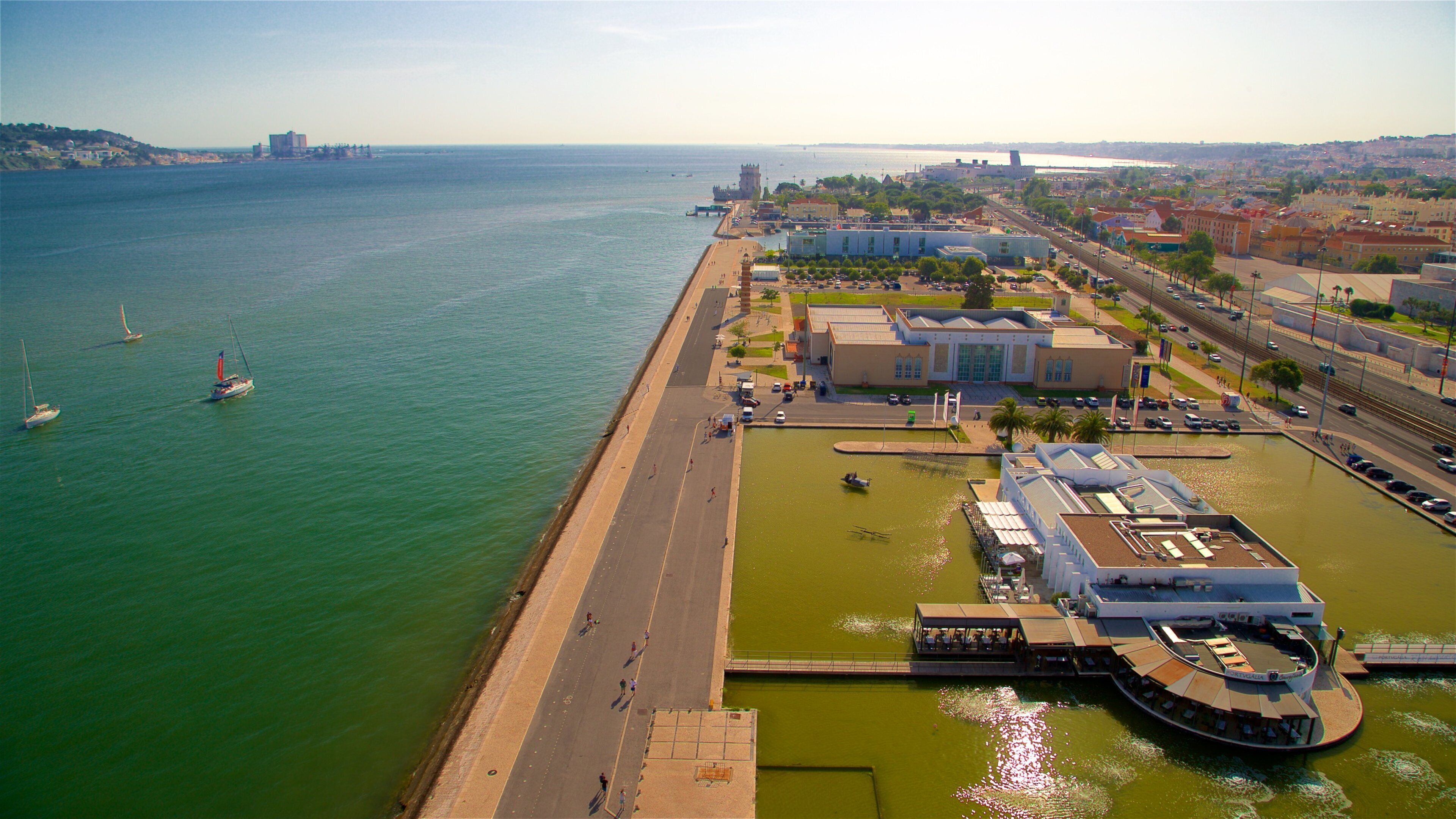 Padrão dos Descobrimentos which includes a bay or harbor, landscape views and a coastal town